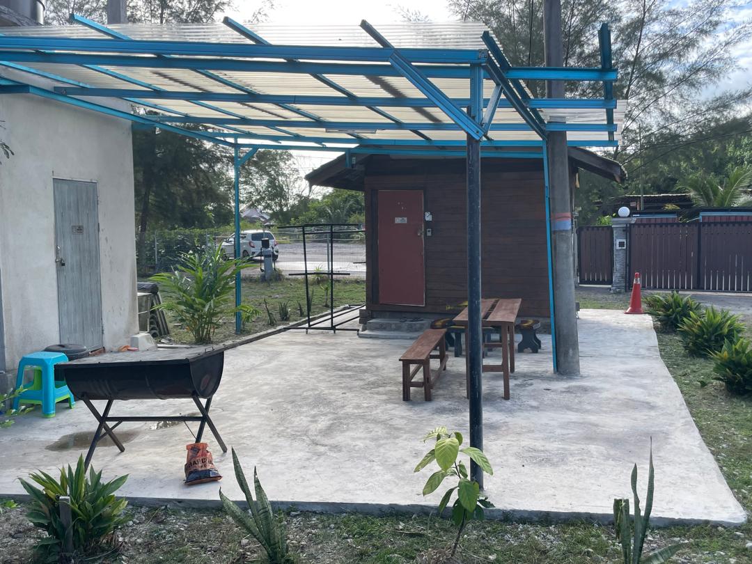 Picnic benches under blue awning