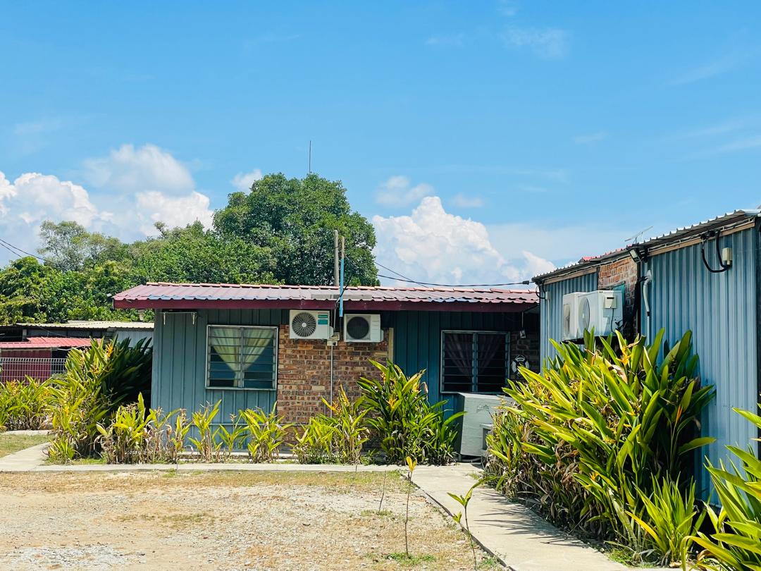 Row of blue cabins under clear sky